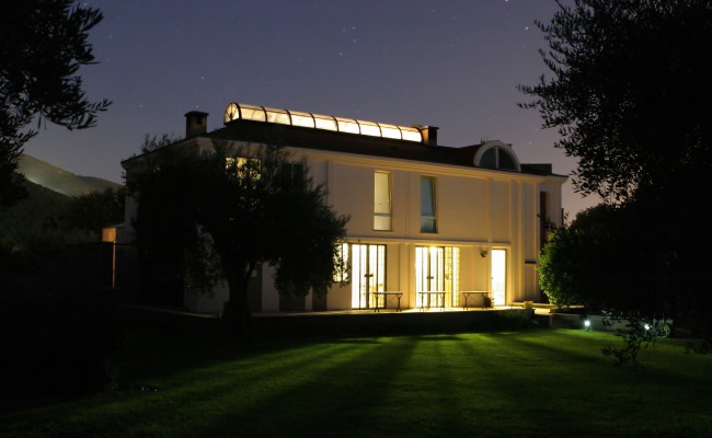 Modern illuminated house in the dark